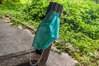 High angle view of wooden post hanging on footpath