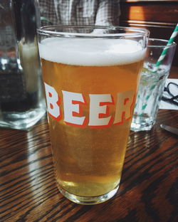 Close-up of beer glass on table