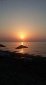 Scenic view of sea against clear sky during sunset