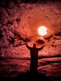 Low angle view of silhouette man against sky during sunset