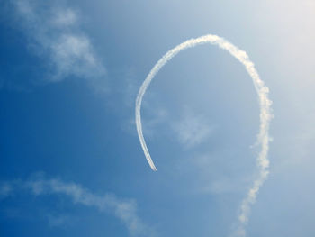 Low angle view of vapor trail against sky