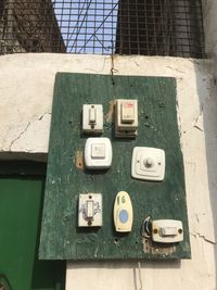 High angle view of telephone booth on wall