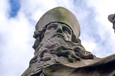 Low angle view of statue against sky