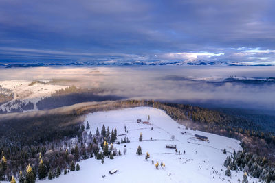 Scenic view of snowcapped mountains against sky during winter