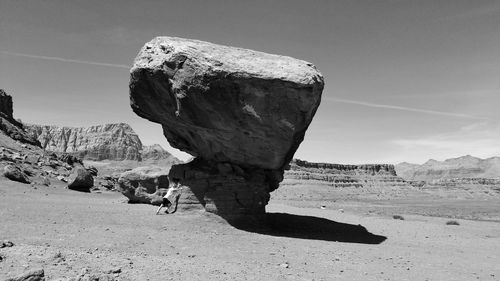 Rock formation on land against sky