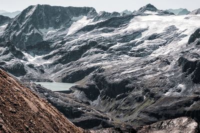 Scenic view of snowcapped mountains and sea