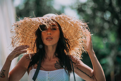 Portrait of young woman wearing hat