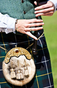 Mid section of a bagpiper