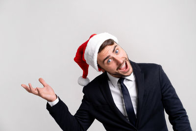 Portrait of man wearing hat against white background