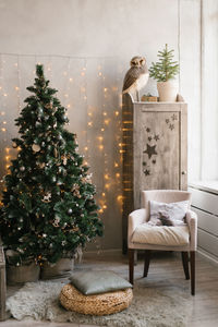 Scandinavian christmas interior decorated with a christmas tree in the children's room. wardrobe