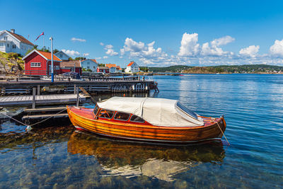 Boats in sea against sky