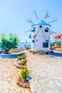 Traditional windmill against clear blue sky