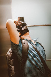 Midsection of woman photographing at home