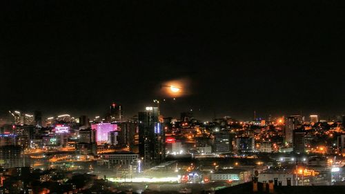 Illuminated cityscape at night