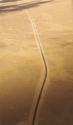 High angle view of road passing through land