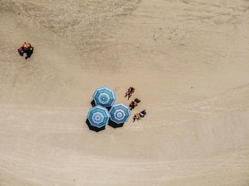 Aerial view of people walking on beach