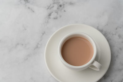 High angle view of coffee cup on table