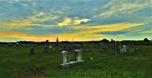 View of cemetery against sky during sunset