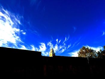 Low angle view of built structure against blue sky