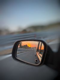 Reflection of car on side-view mirror