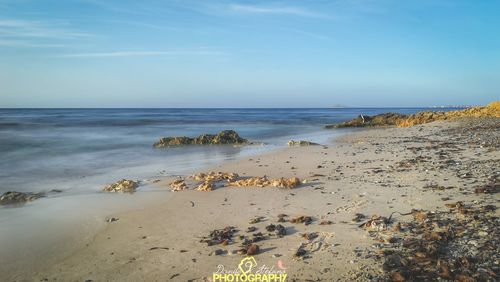 Scenic view of beach against sky