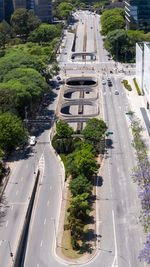 High angle view of road amidst trees in city