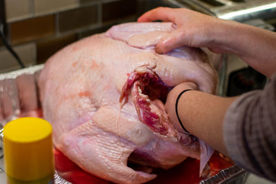 Close-up of person preparing food on table