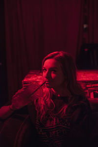 Portrait of a beautiful young woman at a nightclub