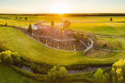 High angle view of cemetery amidst field against sky