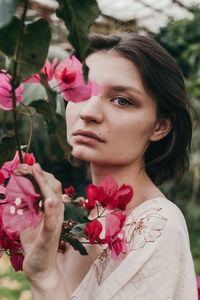 Portrait of woman with pink roses