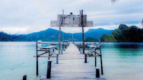 Pier over sea against sky