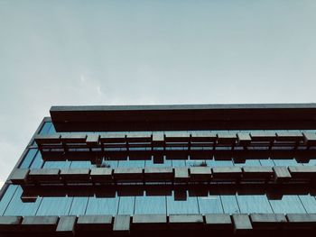 Low angle view of modern building against clear sky