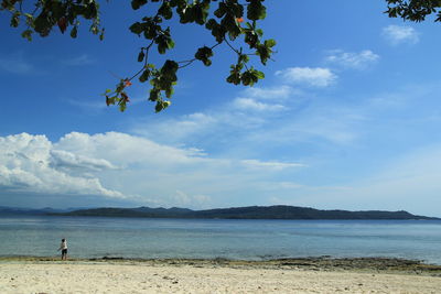 Scenic view of sea against cloudy sky