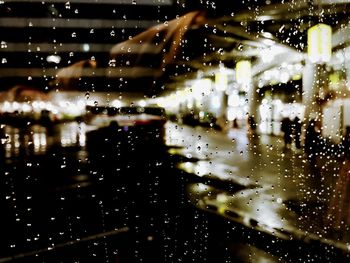 Close-up of wet glass window in rainy season