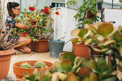 Woman with potted plants in basket