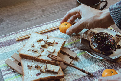 High angle view of person preparing food on cutting board