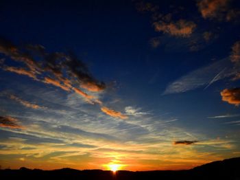 Low angle view of dramatic sky during sunset