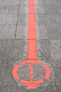 High angle view of arrow sign on street