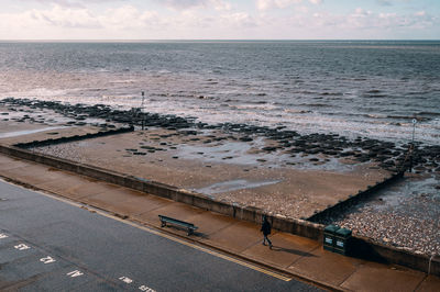 High angle view of sea shore against sky