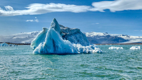 Scenic view of glacier lagoon against sky