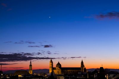 Cityscape against clear sky at dusk