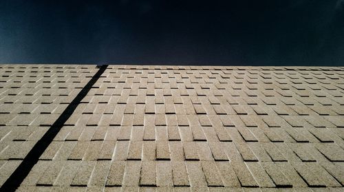 Low angle view of building against sky at dusk