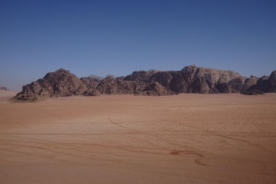 Scenic view of desert against clear sky