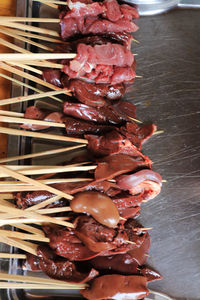 High angle view of meat on barbecue