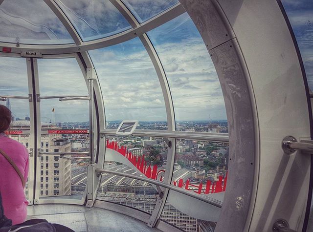 indoors, architecture, built structure, window, glass - material, transparent, sky, travel, lifestyles, person, men, arch, leisure activity, city, famous place, tourism, travel destinations, railing, day