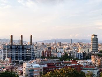 High angle view of buildings in city against sky