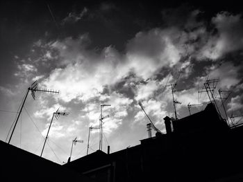 Low angle view of crane against sky