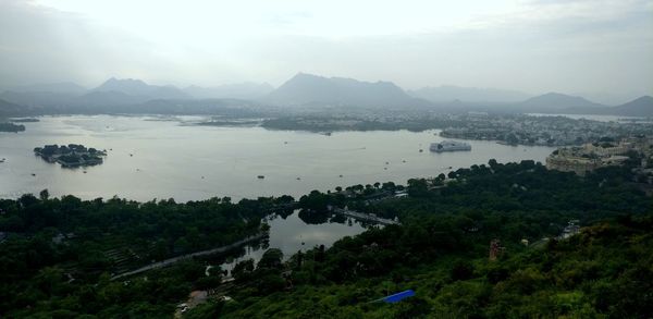 High angle view of trees and mountains against sky udaipur rajasthan.