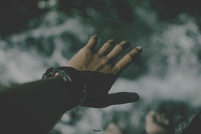 Close-up of hand against blurred background