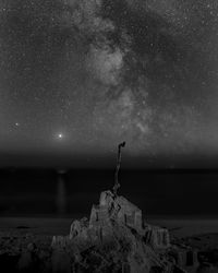 Scenic view of a sand castle against milkyway